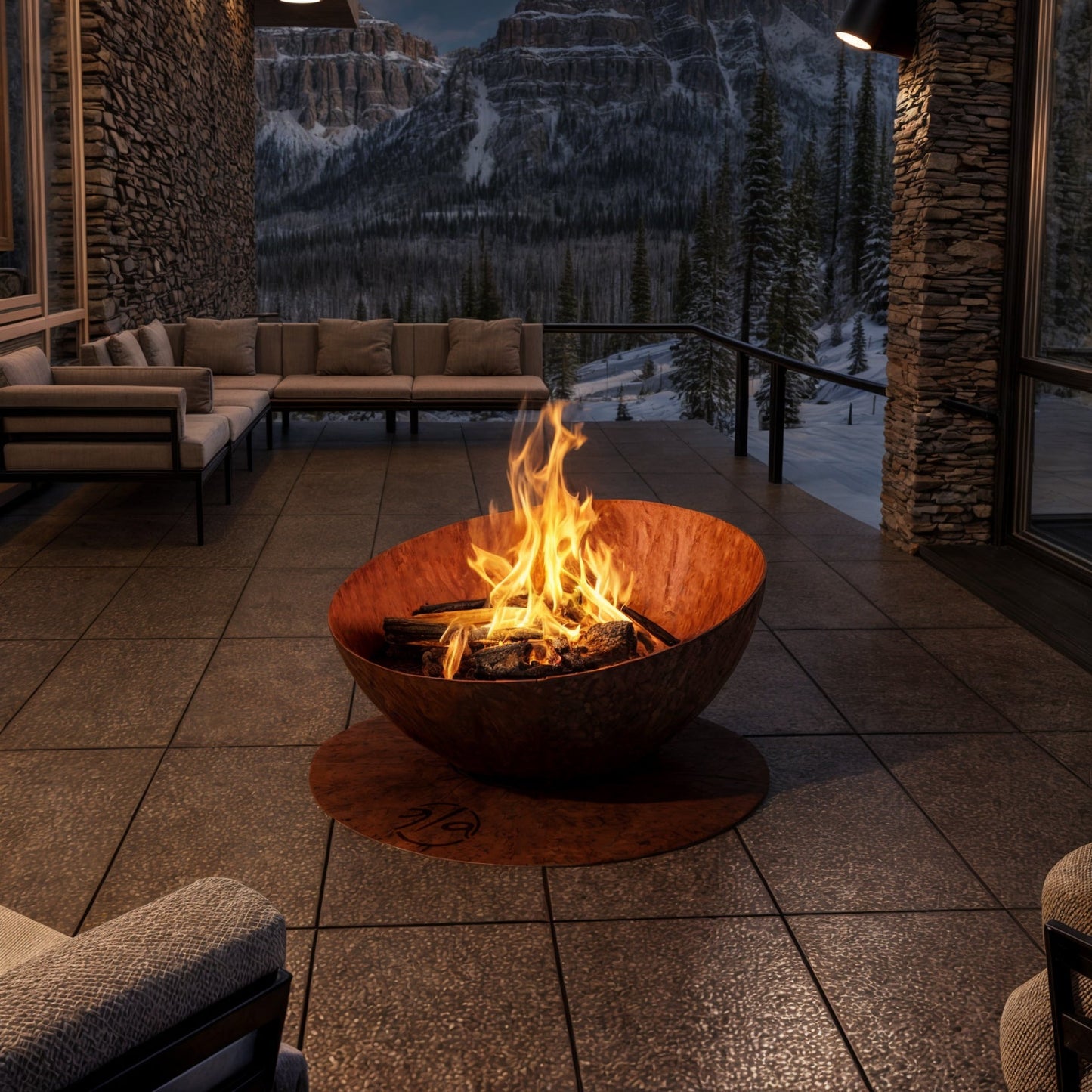 Outdoor patio with fire pit, couches, and mountain view