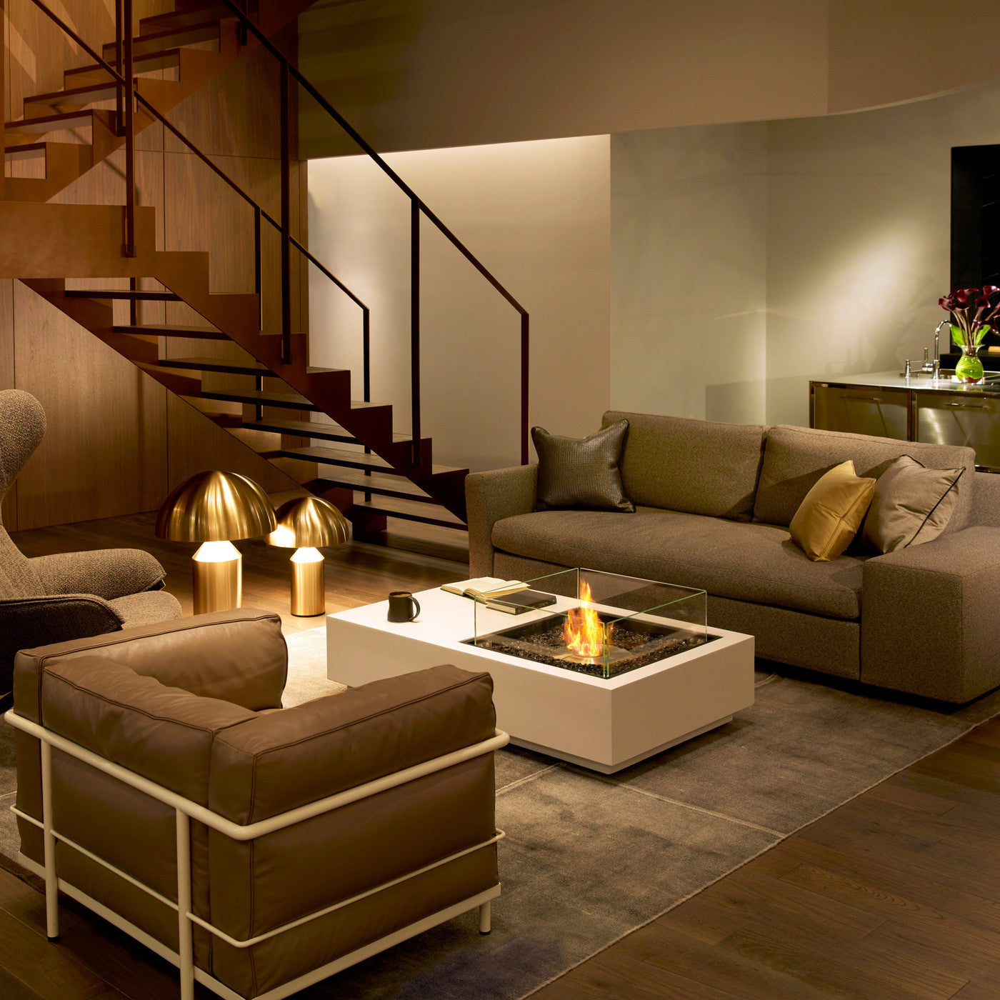 EcoSmart Fire Manhattan 50 bioethanol fire table alight in a modern living room