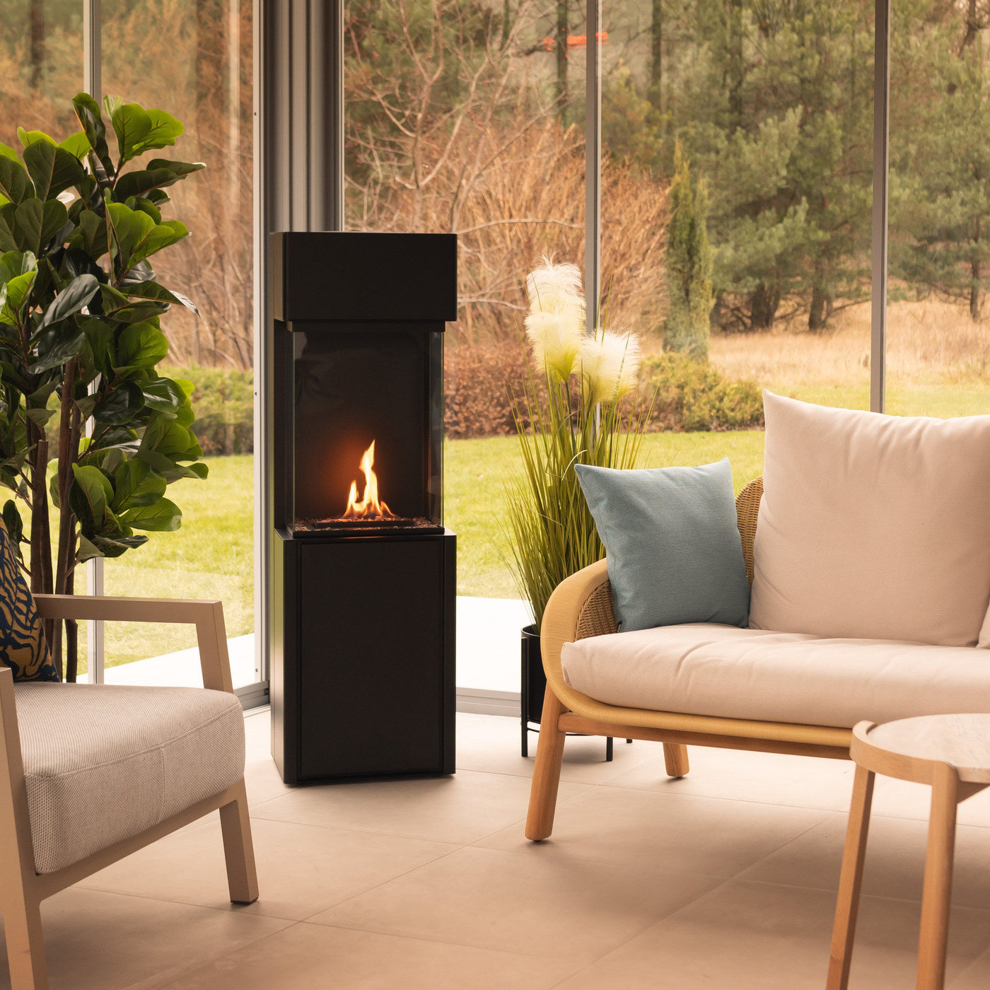 Planika Arcticon bioethanol fireplace lit in a warm interior sunroom